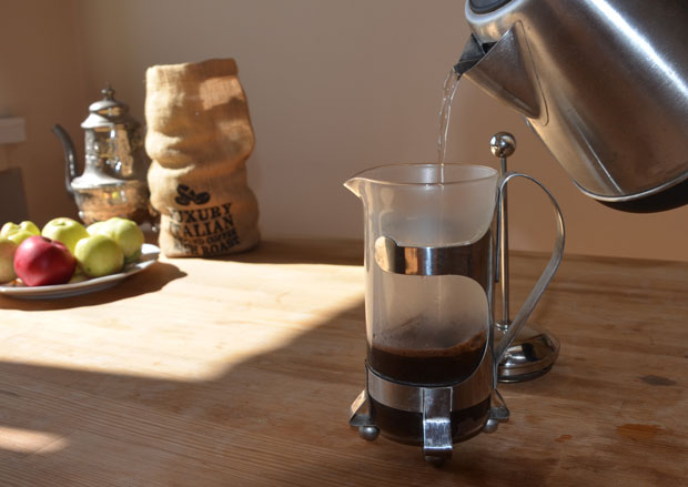 Pouring hot water into a French press